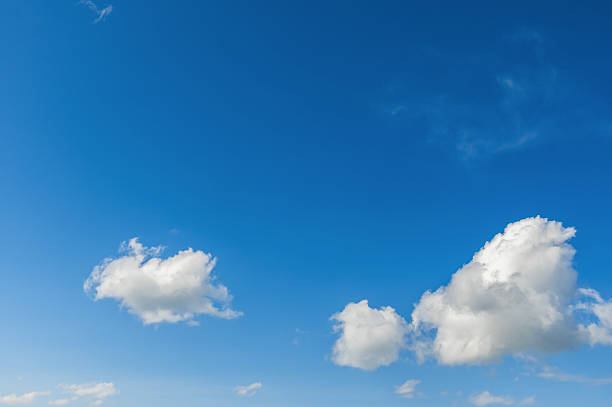istock Fluffy white clouds in the blue sky on a sunny day. 2213658600