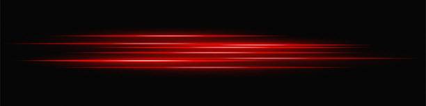 istock Red glowing lines fade into darkness, creating a luminous speed effect and digital motion streak. 2213661696
