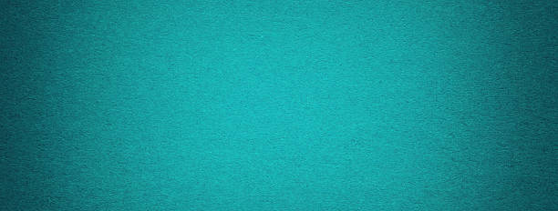 Texture vintage turquoise paper background with dark vignette. Structure cerulean kraft cardboard with frame.