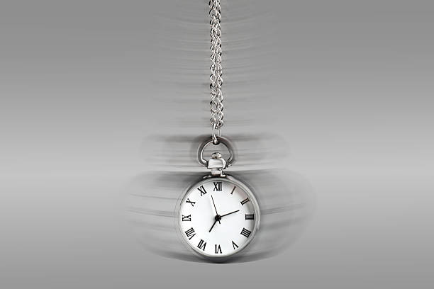 istock Hypnosis session. Vintage pocket watch swinging on grey background, motion blur effect 2213668375