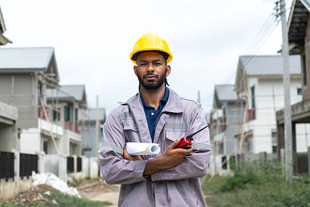 istock Black construction workers look at construction plans and operations to ensure they meet construction standards. 2213669200