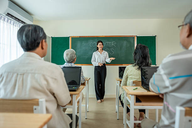 Professional women attending a seminar in a conference room.