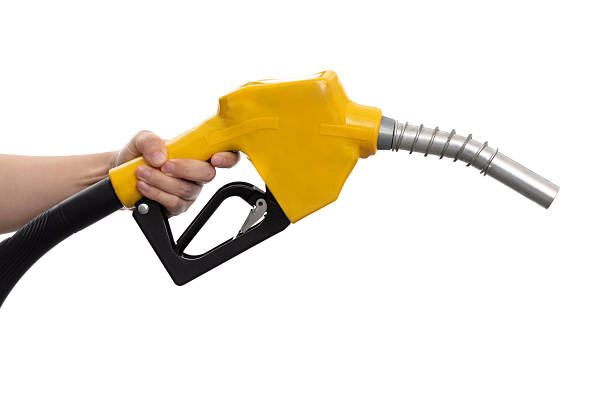 istock Human hand holding gasoline nozzle on white background 2213674062