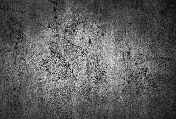 Abstract gray concrete texture with visible scratches and marks, offering a perfect gritty industrial background for design projects or artistic compositions, providing a raw and modernistic aesthetic.