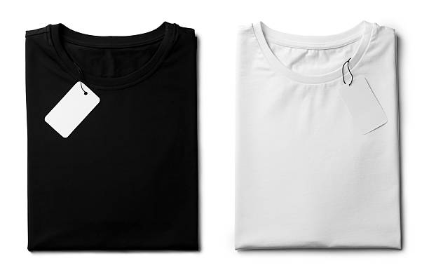 istock White and black folded t-shirts with labels isolated on white, top view. Mockup for design 2213681087