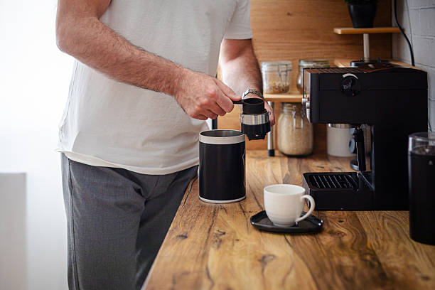 istock Man making coffee in his domestic kitchen, close up 2213681286