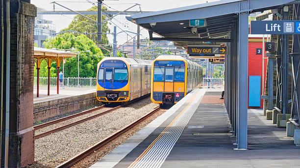 istock Suburban trains passing each other as they transit Arncliffe Station 2213681799
