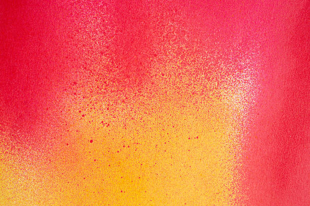 istock Red and yellow spray paint background 2213682120