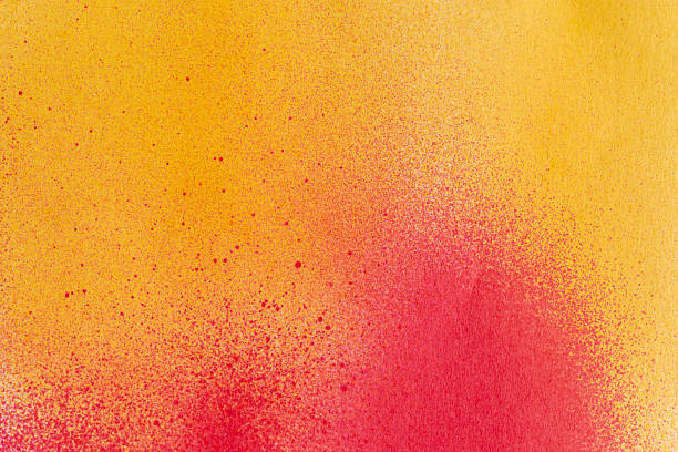 istock Red and yellow spray paint background 2213682184