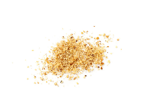 istock Grated wallnut , broken roasted walnuts, heap of nuts crumbs, whole kernel pieces, fractions 2213689849