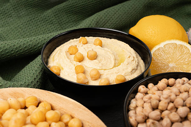 istock Hummus in bowl, houmous dip, chickpea humus tahini sauce, middle eastern spread 2213689976