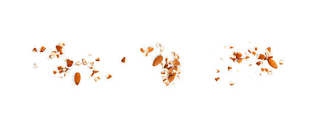 Crushed almonds isolated, nut pieces, sliced scattered almond seeds and cut kernels collection on white background