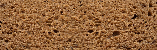 istock Bread slice macro texture, baked dough pattern. Brown bread loaf cut close up, wheat toast slice 2213692856