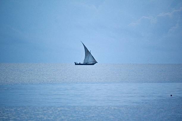 istock Traditional sailboat on calm ocean. 2213695932