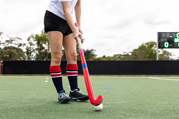 istock Young female field hockey player sets up a shot 2213697321