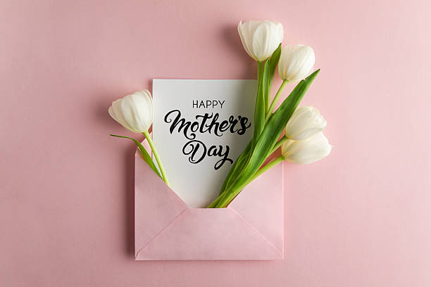 istock Tulips with Mother's Day Card in Pink Envelope 2213697696