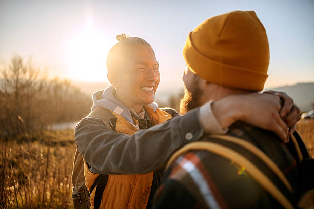 istock Couple of hikers sharing affectionate moment during sunset 2213700698