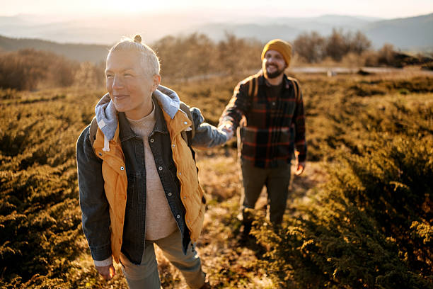 istock Romantic couple walking and holding hands during sunset hike 2213700761