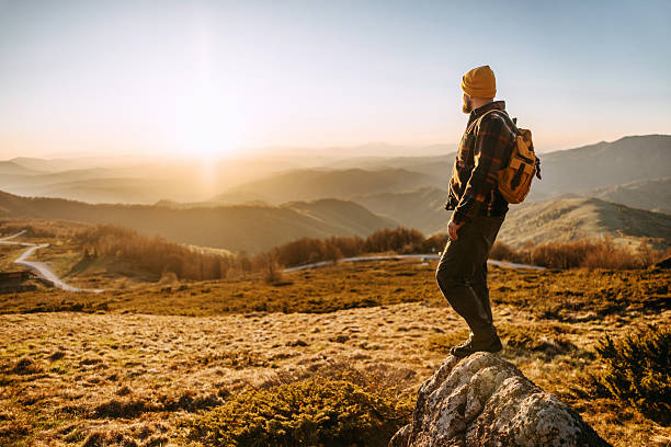 istock Hiker on mountain enjoying the sunset 2213700918