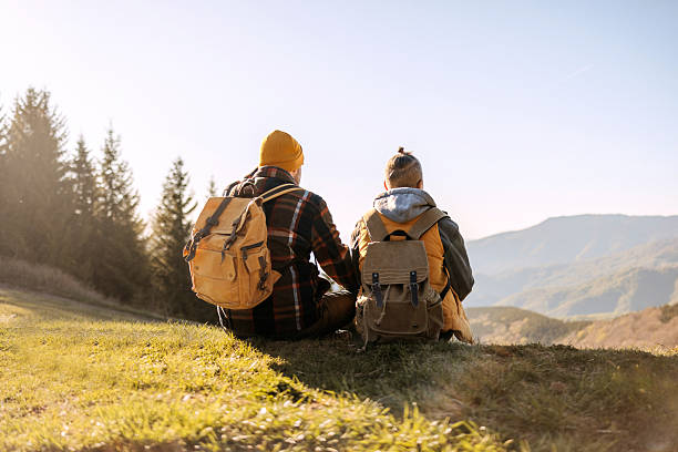istock Couple sitting side by side, enjoying a view 2213702077