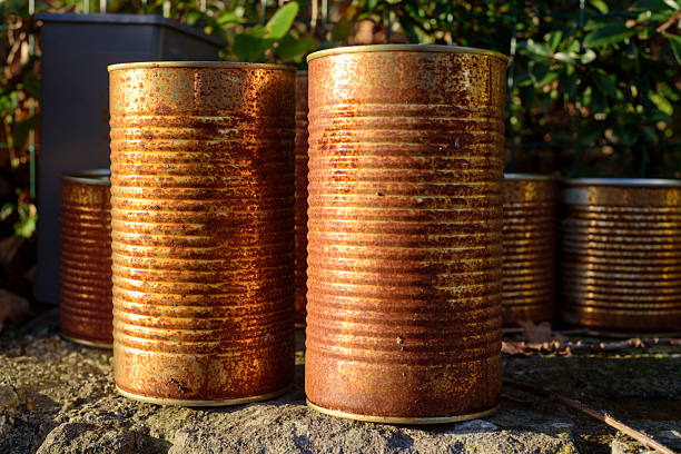 Rusty metal cans in a garden