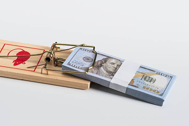 Money bundle caught in mousetrap