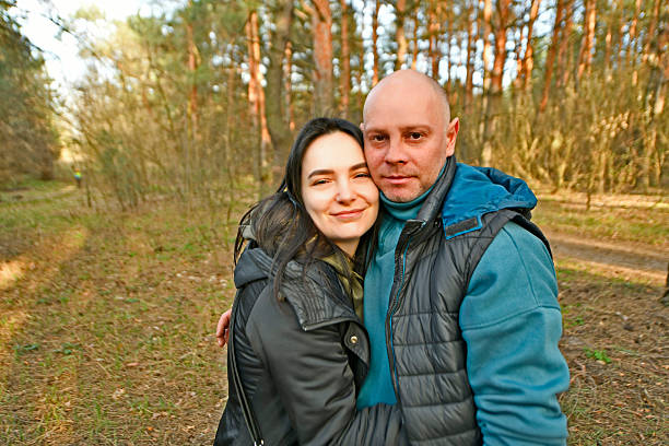 Two married couples with children went out in early spring for their first picnic in nature.