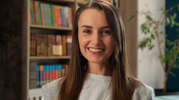 Surprised Caucasian woman female girl library university student study learning education wow amazed excited reaction businesswoman shocked teacher wonder astonish business college school unexpected