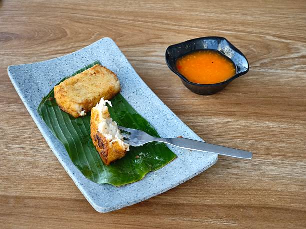 istock Traditional Chinese turnip cake slices being enjoyed 2213706278