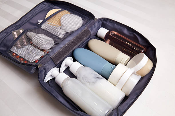 istock A toiletry bag is open on a flat surface, showcasing neatly arranged bottles of shampoo 2213710847