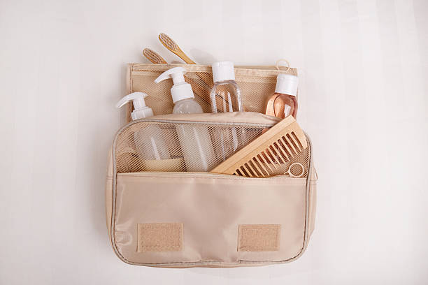 istock A travel toiletry kit is neatly laid out on a white surface. It includes essential personal hygiene items 2213710894