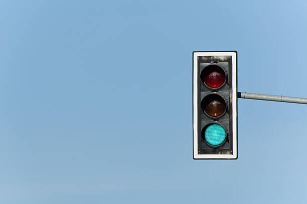 istock Green light on traffic lights. Isolated on blue background. 2213717088