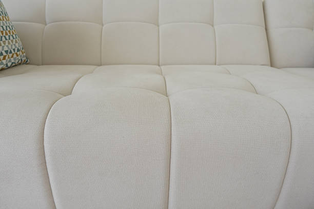 istock An Elegant CloseUp of White Couch Upholstery Featuring Unique Designs 2213719562