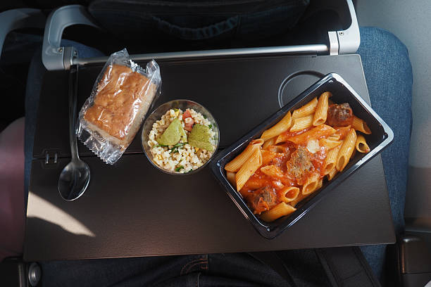 istock Airplane Meal Featuring Pasta with Bread Roll and Creamy Vegetable Salad 2213720665