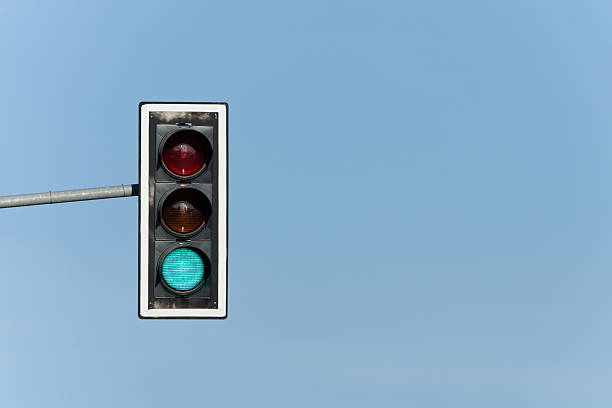 istock Green light on traffic lights. Isolated on blue background. 2213722825