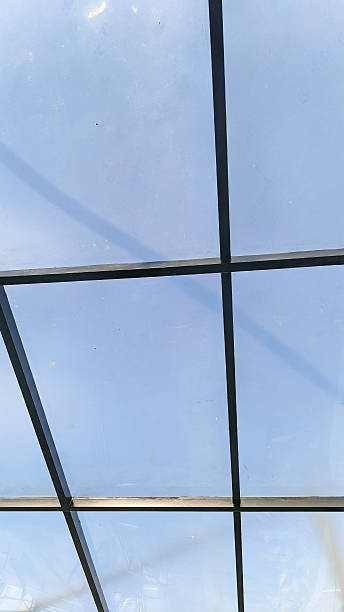 istock Skylight view through a grid of metal frames. 2213723931