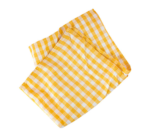 istock Yellow checkered folded tablecloth, gingham crumpled cloth, food decor element isolated. Kitchen towel. 2213726544