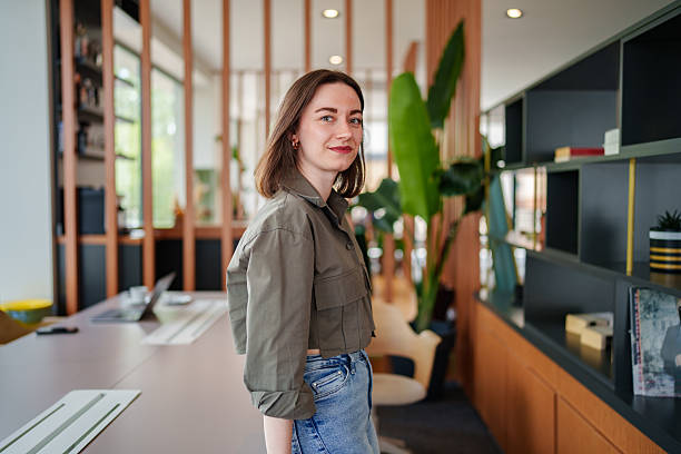 istock Confident Businesswoman Looking at Camera in Office Setting 2213728474