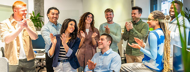 istock Diverse business team clapping and celebrating success in modern office 2213730251