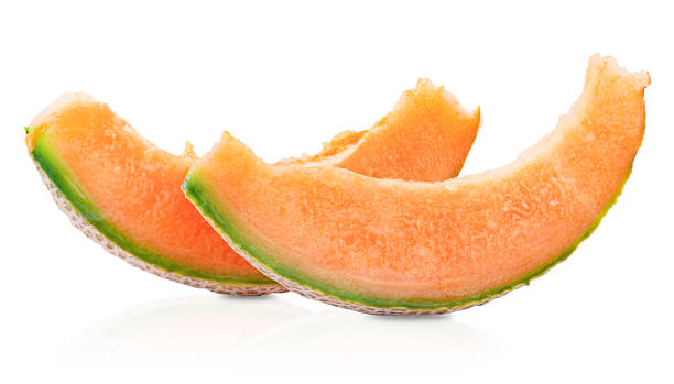 Juicy orange cantaloupe melon slices with green rind isolated on white background. Perfect for healthy food concepts, summer fruits, or diet themes.