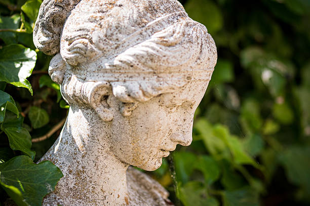 A Balinese statue in a garden