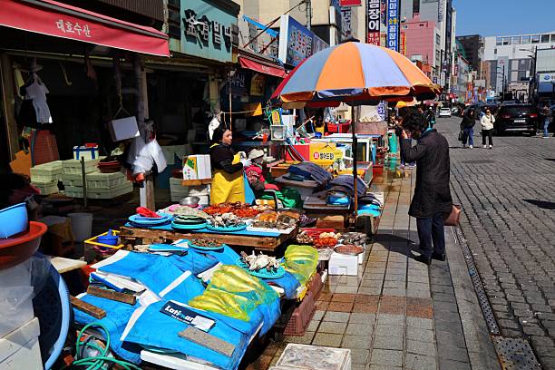 Vendors sell fish and sea food at famous Jagalchi Fish Market in downtown Busan, South Korea.