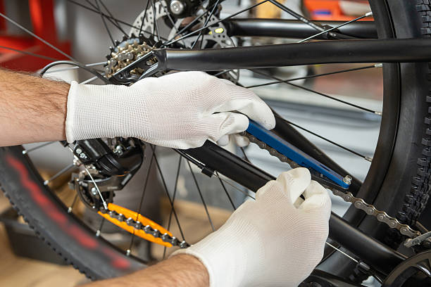 istock Mechanic working on bicycle wheel 2213736577