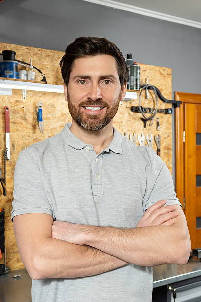 istock Mechanic standing with arms crossed in workshop 2213736609