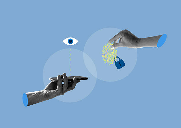 istock Hand with a mobile phone and hand that steals a digital footprint. Security. Data theft. 2213747505