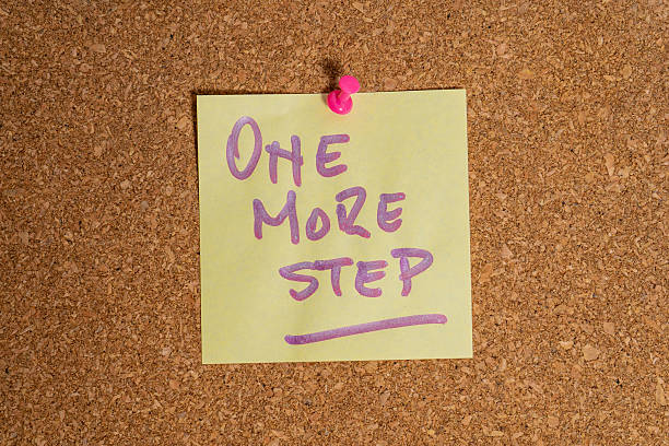 istock One more step written on sticky note pinned to cork board 2213750025