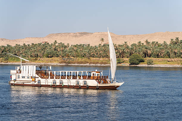 Dahabiya sailing Nile cruise boat traditionally engine-less and towed by tug stock photo