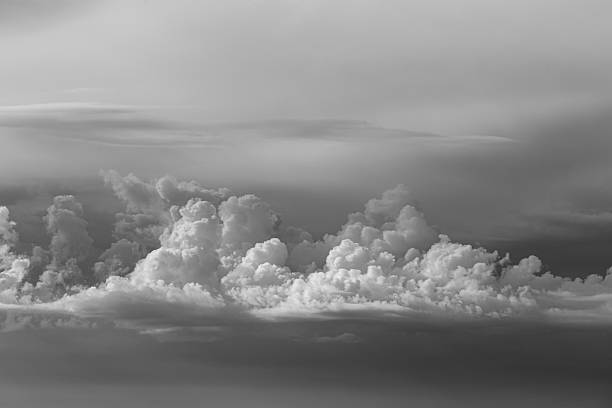 Clear skies and huge, oddly shaped clouds.