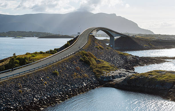 istock Atlantic Ocean Road with famous Storseisundet Bridge, modern highway engineering meets wild Norway nature, sunset view, scenic drive, coastal architecture, iconic travel destination 2213752935