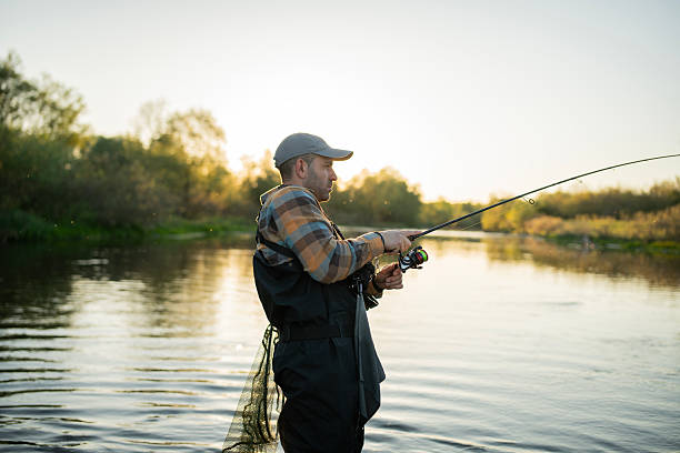 istock Fisherman catch the fish in the river. 2213753121